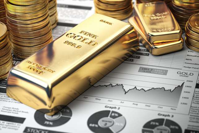 70276155007 gold bars ingots coins set atop precious metal financial report charts getty 70276155007 gold bars ingots coins set atop precious metal financial report charts getty